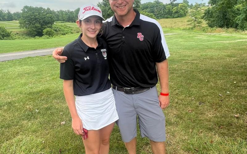 Taylor Bruener along with her father and first-year Ladycats head golf coach Adam Bruener were all smiles following her showing at the Beechwood Invitational on July 28. Bruener shot a new career-low of 76 which tied her for fifth overall. Photo courtesy of Maria Bruener.