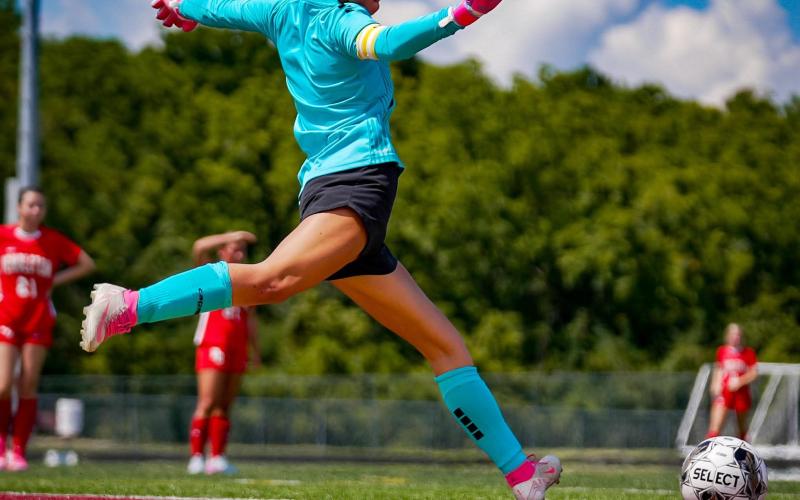 Ladycat goalkeeper Aubrey Record displays her powerful kicking style as she gets set to send the ball into play. Photo by Pete Wigginton.