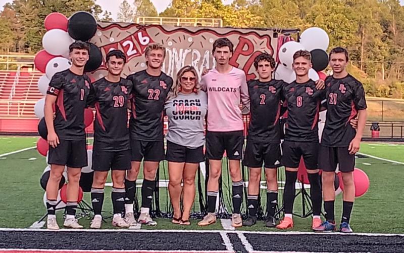 The Wildcats soccer program honored its seven seniors following a home win over Covington Latin on September 16. Pictured from L-R:  Dawson Nichols, Clark Cummins, Alex Mosley, head coach Amber Nichols, Adam Beebe, Patrick Patton, Jacob Frisch and Mason Ammerman. Photo by Sam McClanahan.
