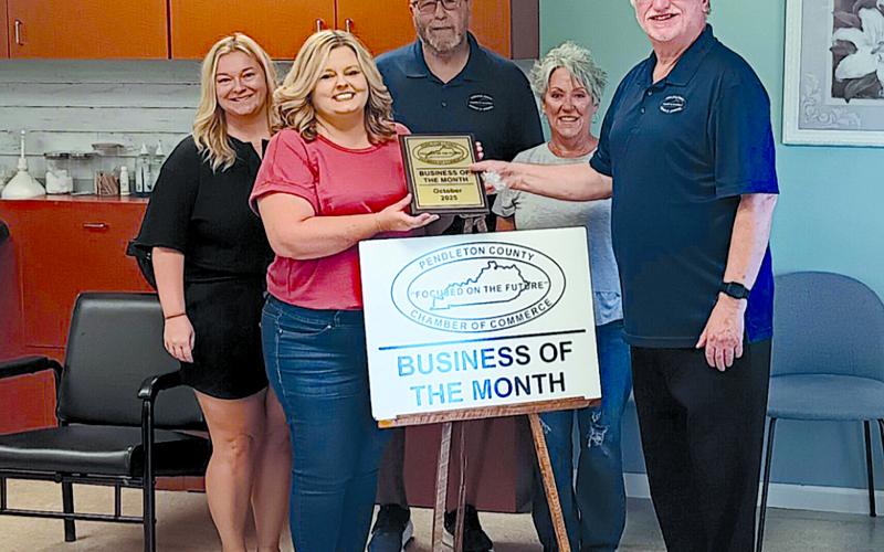Pictured from left are spa employee Angel Winkle, salon owner Lisa Wiggins, Chamber member Randy Wells, Pendleton County Director of Economic and Tourism Development Tami Vater and Chamber President Neil Belcher.