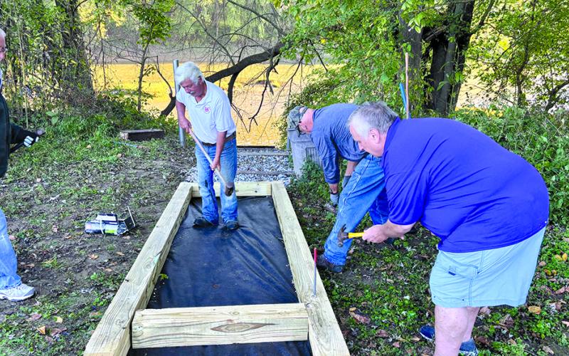 Getting the forms in place are, from left, Patrick Clore, Barth Johnson, Jerry Miller and Darryl Ammerman.