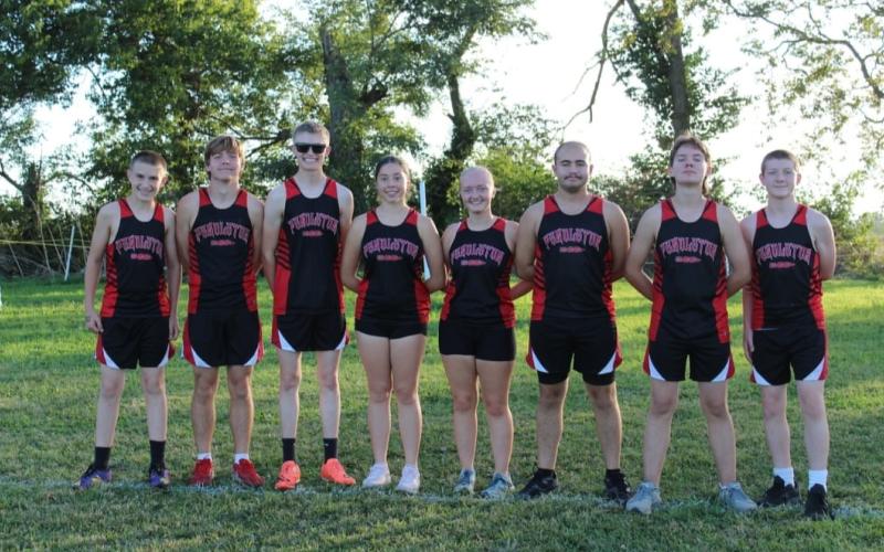 Members of the Cross Country program pose during their meet in Paris. From L-R: Levi Wolfe, Ben Brossart, Klaber Wolfe, Catalina Furman, Aryanna Soden, Josiah Hurdle, Kieran Brayton and Isaac Mardis. Photo courtesy of Natalie Wolfe.