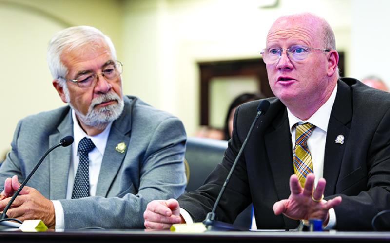 Sen. Greg Elkins, R-Winchester, left, and Rep. Mark Hart, R-Falmouth, tell the Interim Joint Committee on State Government Oct. 21 about their plans to file legislation to remove the state mandate for water fluoridation in 2026.