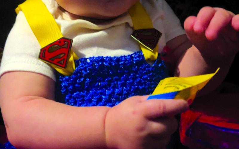 Gabby Flynn of Falmouth dressed up her Superbaby Alora, 8 months old, for her first trick-or-treating experience.