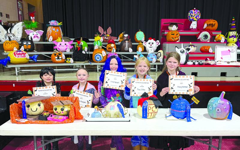 The Northern Elementary School pumpkin decorating contest winners and their creations included:  Braelyn Wilson, Most Creative; Jesse and Evelyn Applegate, Prettiest; Rosie Clifton, Most School Spirit; and Aubrey Workman, Funniest. Missing from the photo is Presley Morgan, Kid Created.