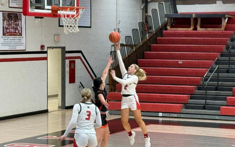 Ladycats senior Lilly Ashcraft rises over her defender for a layup during the teams home win over Raceland. Photo provided by Alicia Teegarden.