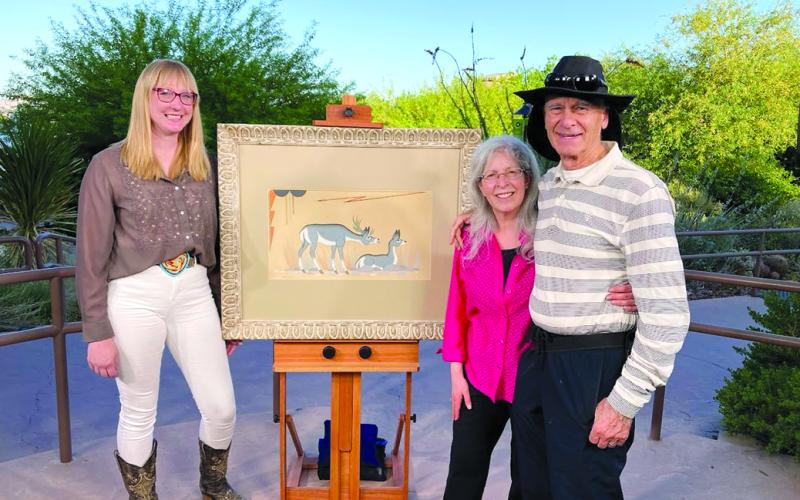 Pendleton County High School graduate Erin Rust, left, appraised this circa-1950 Native American tempra painting by noted artist Acee Blue Eagle during a 2025 episode of “Antiques Roadshow” that was shot in Las Vegas. She told the couple, whose names were not given, that the piece would bring $2,000 to $4,000 at auction. Rust grew up in Butler and is an appraiser for Freeman’s/Hindman auction house in Cincinnati. Photo courtesy of Erin Rust.