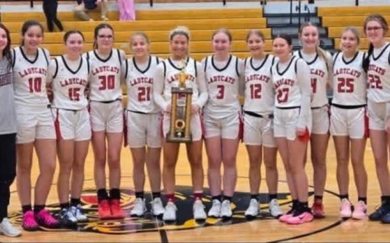 The Ladycats pose with their championship trophy following a 57-49 victory over Lloyd Memorial in the finals of the Pam Browning Classic.