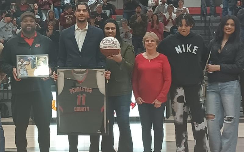 He's pictured with his parents Tony and April Allen-Thomas, grandmother Debbie Allen, and siblings Jalen and Saniah Thomas. Photo by Sam McClanahan.