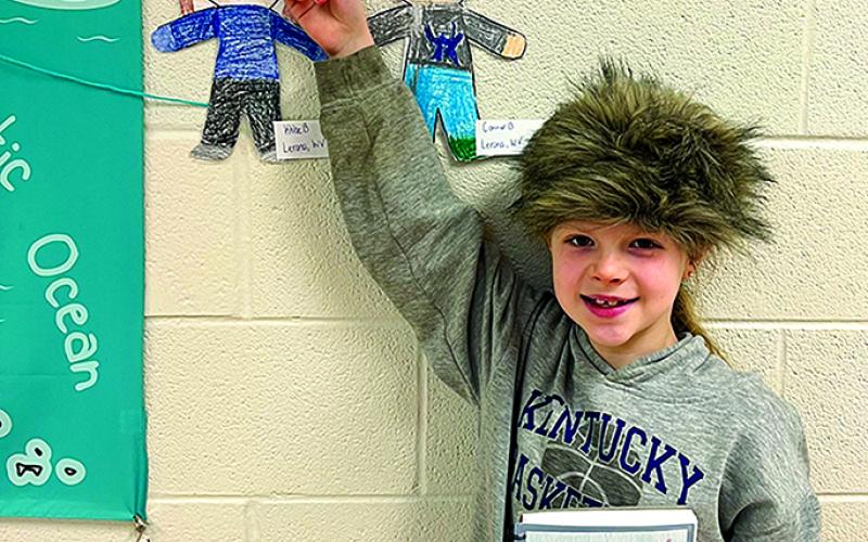Second-grader Avery Roberts points to her character next to a map showing from where the classes’ Flat Stanley letters were sent.