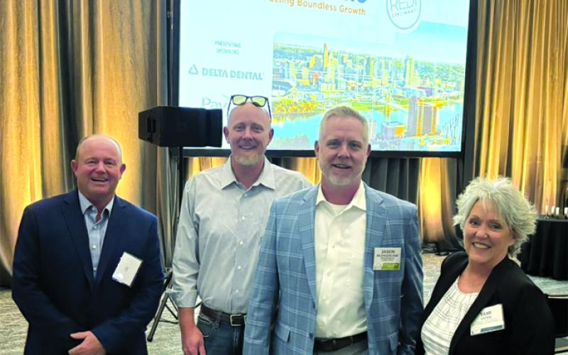 Rick Mineer, Pendleton County Fiscal Court Magistrate Rick Mineer, left, Paragon co-owners Bryan and Jason Meuhlenkamp, and Tami Vater, Pendleton County Economic and Tourism Development director, celebrate Paragon’s recognition.