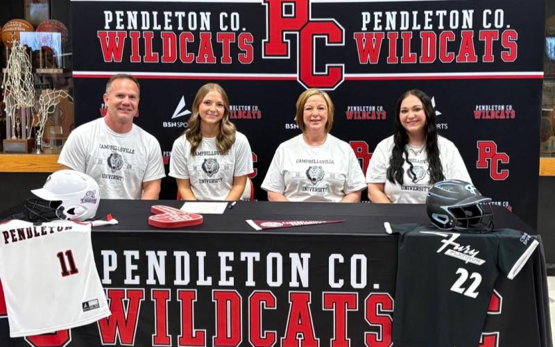 Pendleton County senior Mylie Honnert, pictured second from left, signed with Campbellsville University on March 7 to continue her academic and athletic pusuits in Fastpitch Softball. She's shown above with her parents Jeremy and Michelle, along with her sister Isabelle. Photo courtesy of Jon Wirth.