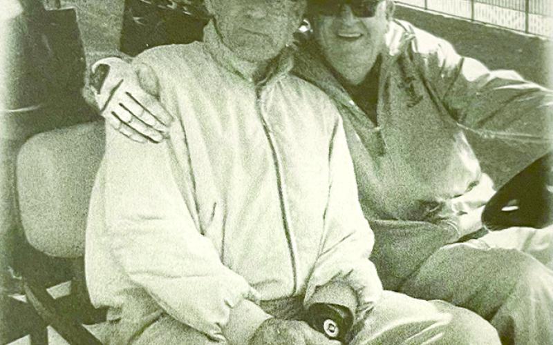 Doc, right, is all smiles with his favorite golf buddy, former county Judge Executive David Pribble.