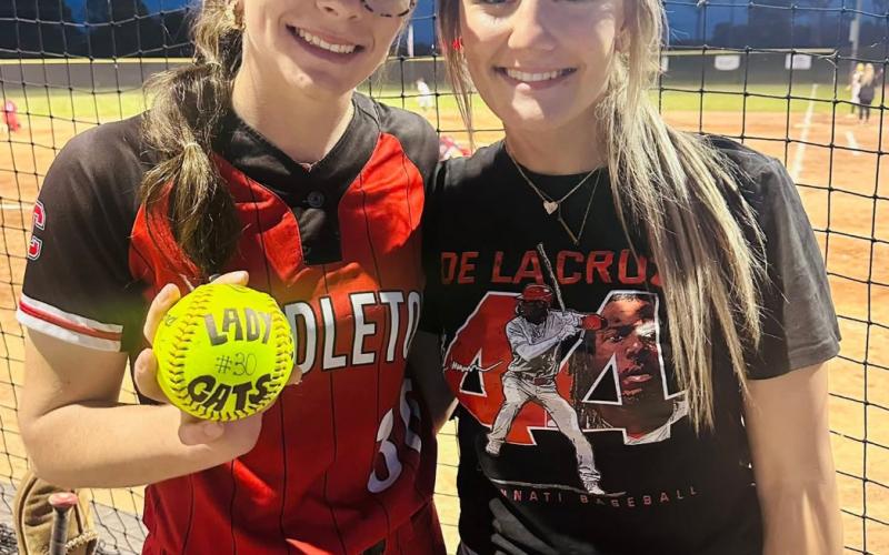 Ladycats ace pitcher Hannah Spaulding, left, poses with her younger sister Hadley after striking out a new career-high 16 hitters versus Woodford County.