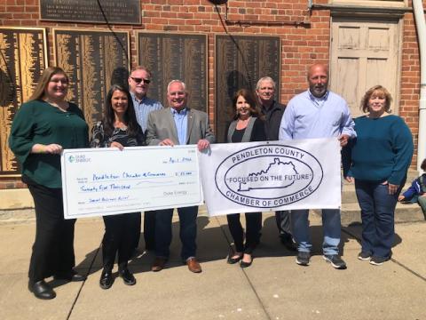 Kim Volgelgesang of Duke Energy Foundation presents a ceremonial check to the PC Chamber of Commerce with Melanie Hartzel of the PC Tourism Council and Judge/Executive David Fields. The money will be available to businesses who need help with past expenses as well as those who have future need. Applications will be reviewed starting mid-May.
