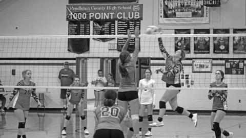 #10 Katelin Aulick is on the move as she soars through the air to play the ball back across the net. Photo by Scott Collins