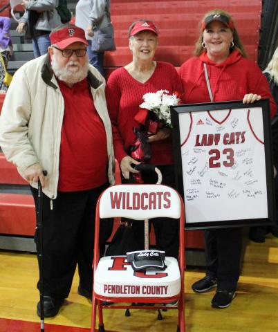 The family of the late Scott Collins was recognized by the Ladycats before the start of their December 7 home game against Dayton. Photo by Stacey Myers
