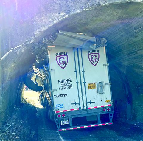 A truck driven from Canada was lodged in the tunnel that leads from Butler to the Demossville area last Tuesday. The truck was cleared from the tunnel, allowing schools to be dismissed on time. Photo by Mayor Mason Taylor.