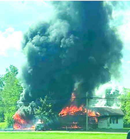 The home of Alex and Allie Dennison was destroyed by fire Labor Day morning. The home was a total loss. The walls to the right of the house are the only things left standing. Photo from Kentucky Millstone.