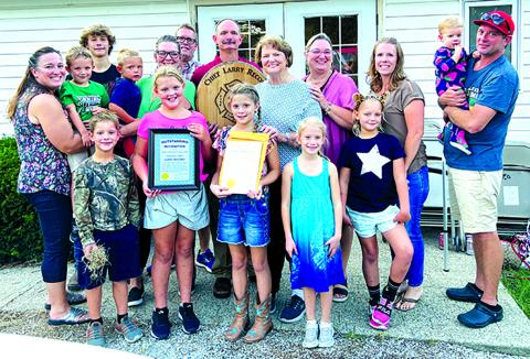 Larry Record, center, is pictured with his family. Record is a third-generation firefighter, having his grandfather and father go before him; in fact, much of his family has been involved in firefighting in some fashion.