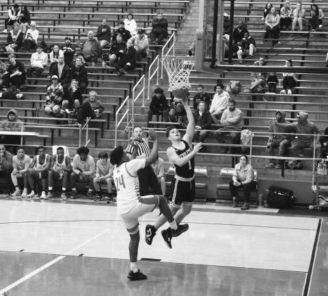 Senior Hunter Jack drives in for a layup during the Wildcats road victory at Holmes. Photos by Sam McClanahan.