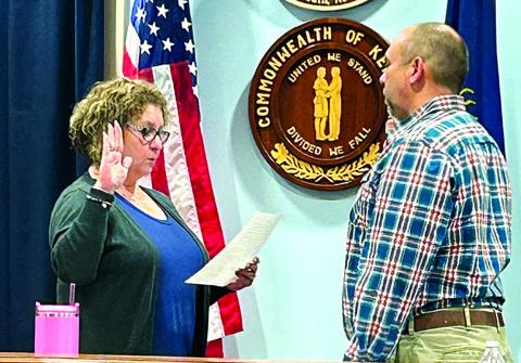 City Clerk Susan Bishop, left, swears in new mayor Luke Price at the beginning of a specially called City Council meeting Jan. 9. Price has been an active member of City Council for five years. He replaces Sebastian Ernst and will be up for special election in November. Photo by Brian Reid.