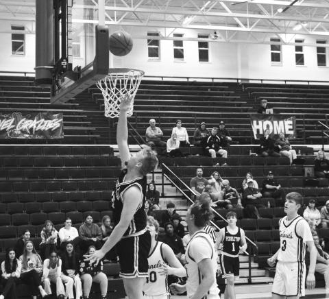 Wildcats senior Austin Kirsch goes up for two of his 10 points in the road win at Bourbon County on January 11. Photo taken by Sam McClanahan.