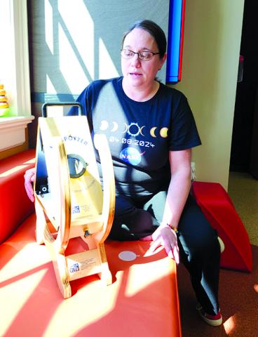Pendleton County Public Library Programming Assistant Hannah Pearson describes the workings of the Sunspotter, one of several pieces of equipment the library will discuss Friday during a free Solar Eclipse Tips and Tricks event at Kincaid Lake State Park Conference Center in preparation for the total solar eclipse happening April 8. Photo by Burton Cole.