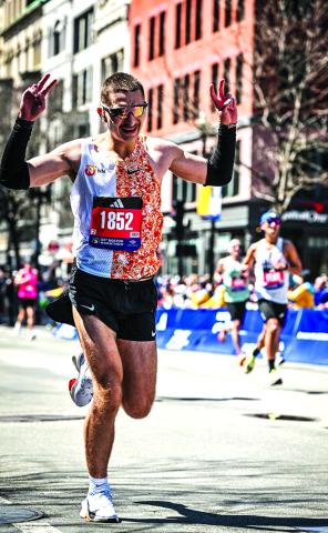 William Burns of Falmouth Burns crosses the finish line of the Boston Marathon in time of 2:46:27, finishing 833rd overall out of 25,530 entrants who completed the race April 15 in and around Boston. Burn said that the cheering crowds were a great motivator. Photo courtesy of William Burns.