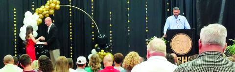 Pendleton County High School senior Rebecca McCoy receives a scholarship from Principal Tony Dietrich during the Senior Scholarship Ceremony May 7 at the high school. Photo by Jemi Chew.