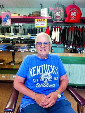 Lisa Houchen sits in the department store in Falmouth that's been part of Pendleton County history for more than a century. The store has closed and Houchen has retired from the family store. “You grow up on a farm, you learn how to do farm things,” Lisa said. “I grew up in a store so that was what I knew to grow up to do.” Photo by Jemi Chew.