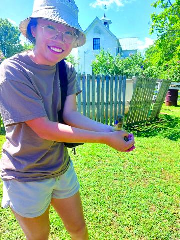 Jemi Chew holds a duckling at BlackSheep Farmstead during the 2024 Pendleton County Farm Tour on Saturday.