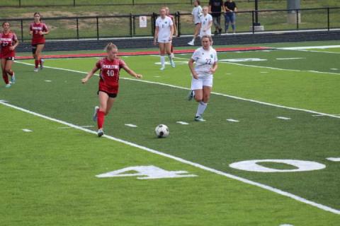 Ladycats Senior Addison Wright eyes the ball. Photo by Kacia Shipley.