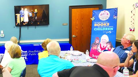 A livestream is held at PCPL as Gov Andy Beshear and First Lady Britainy Beshear talk with Dolly Parton..