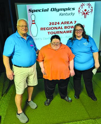 Bowling coaches Jude, left, and Toni Zilliox stand with Elijah Combs, center, who placed fifth last week in the Northern Kentucky Special Olympics Regional Bowling Tournament. Photo courtesy of Judy Combs.