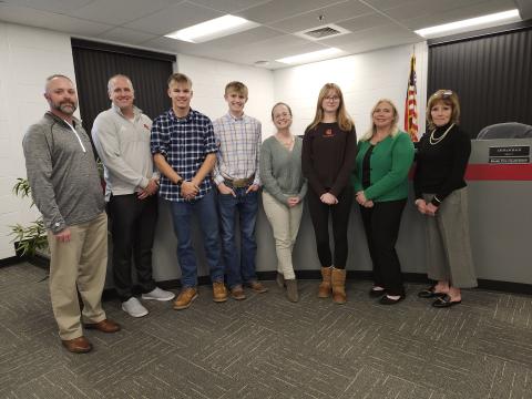 The Pendleton County Board of Education last week recognized cross country team members who qualified this year for state competition. From left are board members Derek Brown and Kevin Barnard, Pendleton County High School team members Sam Hodge and Klaber Wolfe, board member Laura Schack, Sharp Middle School team member Taylor Flannigan, and board members Amber Beebe and Cheryl Griffin. Photo by Burton Cole.