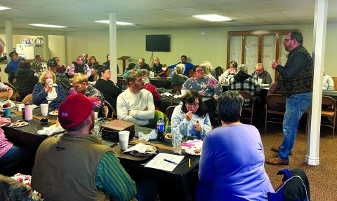 Pastor Darren Edwards, standing, addresses members, family and friends during a celebration on Jan. 19. The church was established Dec. 28, 1799, at the home of Brother Beuthel Riggs. Photo by Nila Harris.