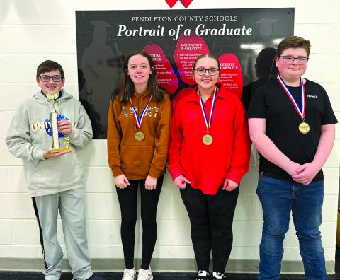 The Sharp Middle School Problem Solving Team, with their first place medals, are, from left, Jackson Jacobs, Hallie Cahill, Estelle Aulick and Carter Dunn. Photo courtesy of Cassandra Jacobs.