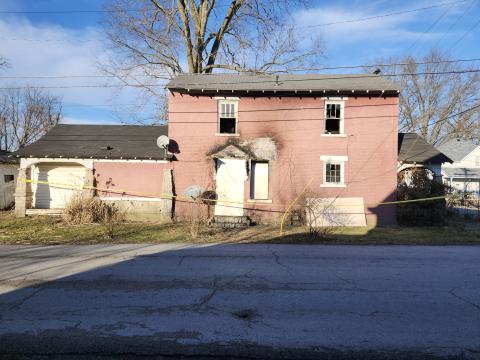 The historic brick building at Second and Maple streets in Falmouth received heavy damages in a Jan. 27 fire was the city's first jail in the early 1800s. It was boarded up over the weekend. Harold Macallister, who was buying the house from his brother Gary, who lived there, said he didn’t know if the building could be saved. Photo by Burton Cole. 