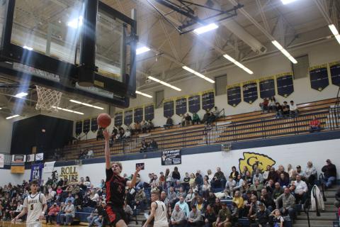 Sophomore Hunter Keeton rises for a one-handed floater during the team's road victory at Grant County on Feb. 21. Photo by Sam McClanahan