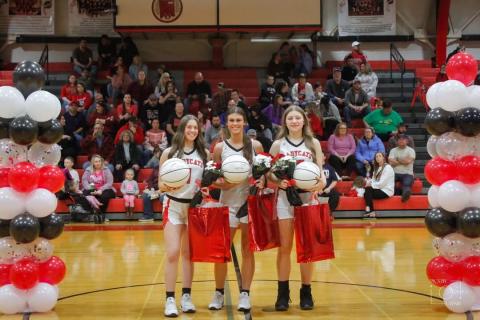 Prior to the start of the Ladycats home game with Robertson County on Feb. 8, the senior trio of Madison Verst (left), Kearstin Mayer (middle) and Skyler Thacker (right) were honored. Photo by Layne Nelson.