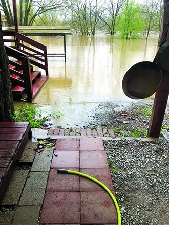 Jim Thaxton took this photo from the one looking out the office door of Thaxton’s Canoe Trails and Paddlers’ Inn in Butler. “We have a saying up there: ‘When the river reaches 44, it is at our door.’ It was right at 42 feet when the photo was taken,” he said.