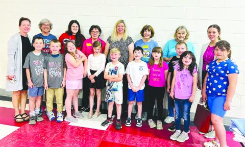 One to One mentors at Northern Elementary include, back row from left, organizer/media specialist Tina Record, Coach Penny Wheatley, teacher Maddie Flaugher, toach Eleen Utz, teacher Jennifer Redden, Coach Carole Bowen, Coach Diane Herrman, and Teacher Olivia Schultz; and front row in no particular order, Sunny, Gabe, Raylynn, LeeAnn, Vincent, Kylie, Caster, Lilly, Kierra, and Jackson.