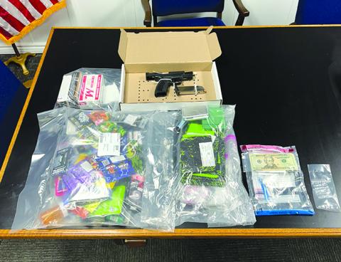 Suspected drugs, drug paraphernalia and weapons and ammo seized after a traffic stop in Falmouth are displayed at the police department. Photo courtesy of Falmouth Police Department.