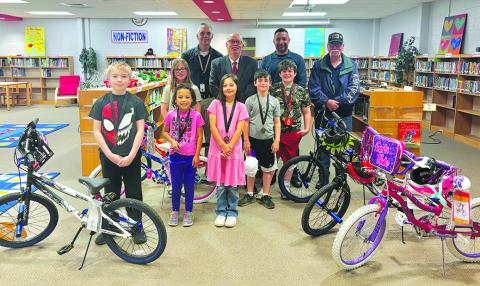 Southern Elementary School students rewarded in the Masonic Bicycles in Schools for Attendance Program are, from left, are Elijah Bess, Alynah Younger, Emma Barlow, Madalyn Butler, Levi Hilterbrand and Christopher Bishop. In the back row are SES Principal Mark Hegyi and Masons Rick Halcomb, Jeremy Moore and Steve Bowman.