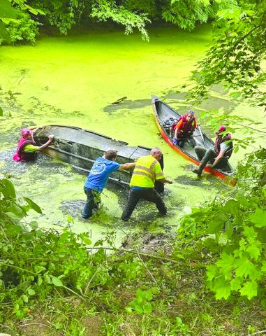 The county Fire and Rescue team focused on cleaning up a local lake in Butler, removing large items that includes a wooden boat ramp, canoe and jon boat that had been in the lake since 1989. 