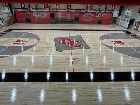 New additions include the 10th Region logo just inside of both free throw lines plus an outlined shape of Pendleton County with the initials 'PC' at mid-court.