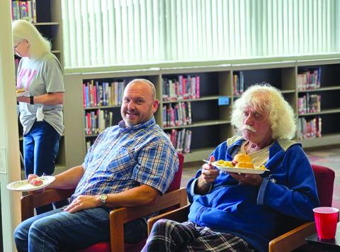 Pendleton County schools bus drivers Jimmy Gregg, right, and Bill Feltner, and bus monitor Louise Browning enjoy their lunch. Photo by Nila Harris.