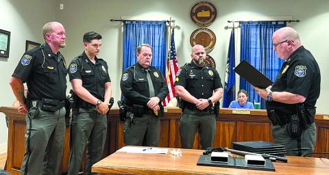 Falmouth City police who were awarded commendation medals and citations from police Chief Marty Hart, right, during a City Council meeting last Thursday for their actions during a May 17 rolling shootout between the passengers in two vehicles were, from left,  Assistant Chief Nick Timon, Officer Matthew Campbell, Sgt. Ken Hall and Sgt. Brody Schmeing, Not pictured are officers Shy Thompson and Kyle Florer. Photo by Jim Thaxton.