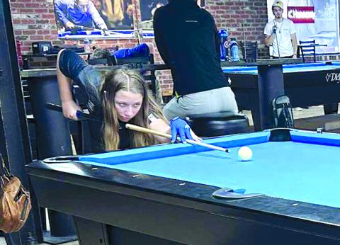 Jeanna Gregg, 12, of Falmouth, lines up a shot at the 2025 Junior World All-Around pool tournament in Louisville. She was the youngest out of 40 contenders at the event. Photo courtesy of Gale Gregg.